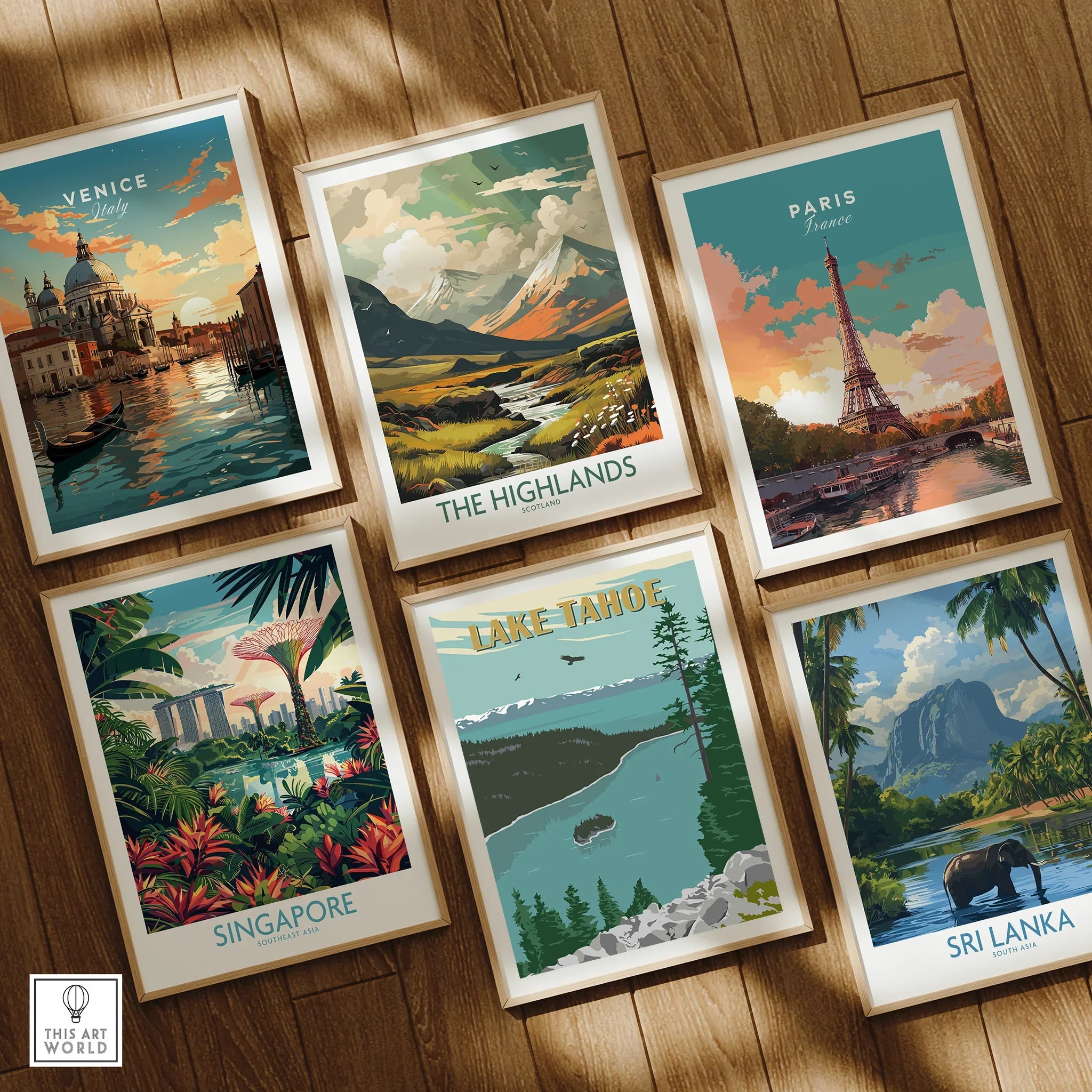 Set of six framed travel art prints featuring Venice, Paris, Highlands, Singapore, Lake Tahoe, Sri Lanka on wooden floor