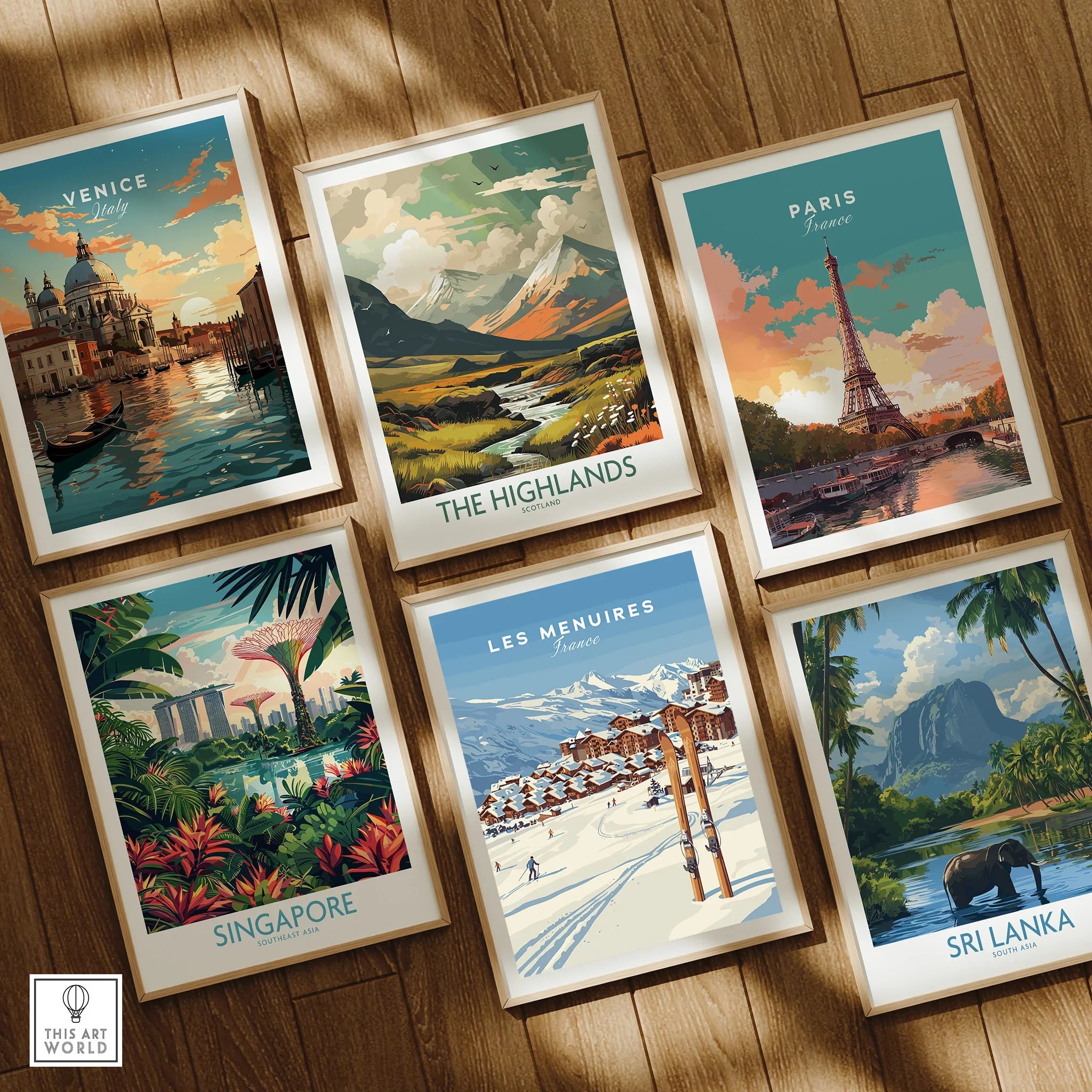 Set of six framed travel posters featuring Venice, The Highlands, Paris, Singapore, Les Menuires, and Sri Lanka on a wooden floor.