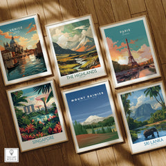 Set of six framed travel art prints featuring Venice, Paris, Highlands, Singapore, Mount Rainier, and Sri Lanka, displayed on a wooden floor.