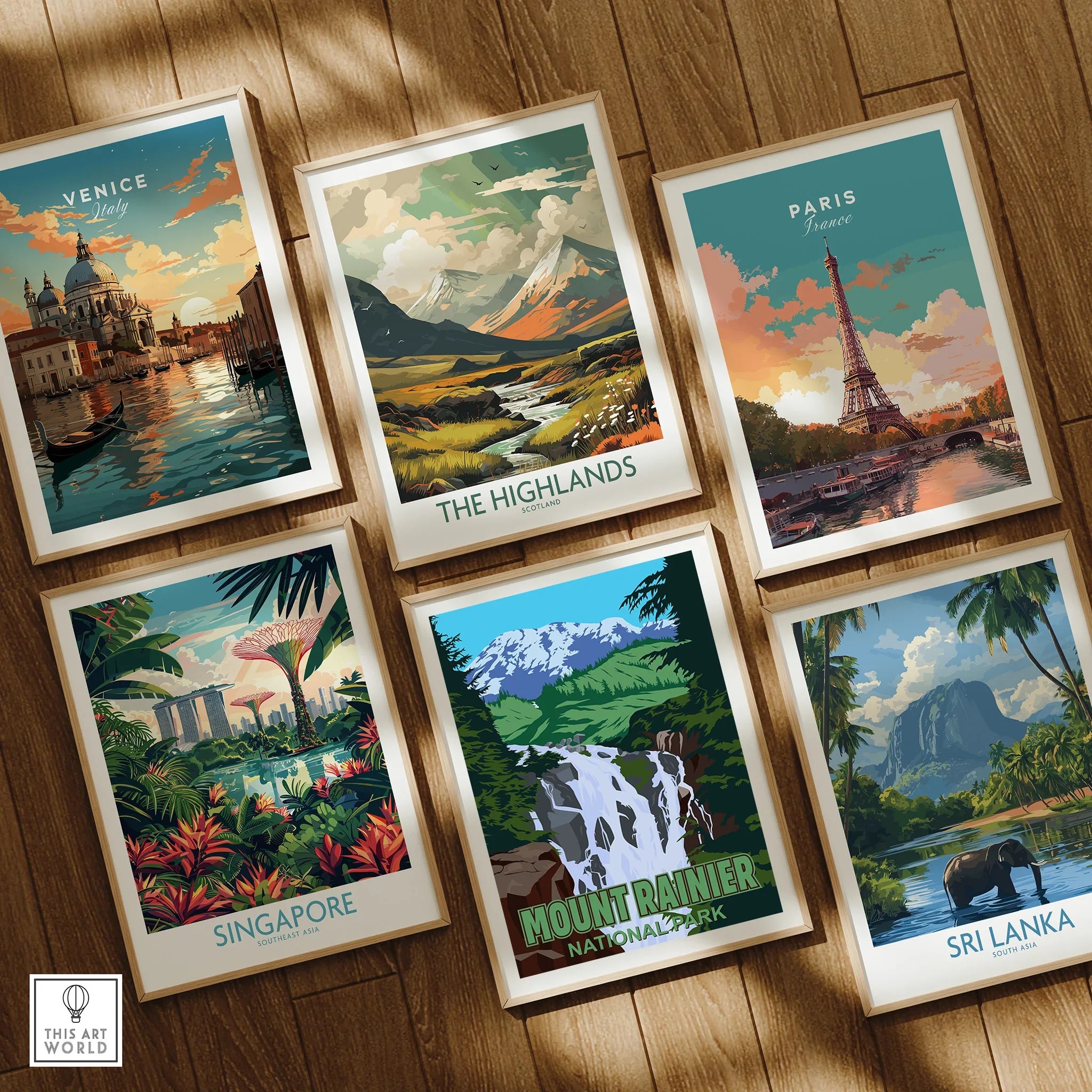 Set of six framed travel posters featuring Venice, Paris, Singapore, Mount Rainier, Highlands, Sri Lanka on wooden floor