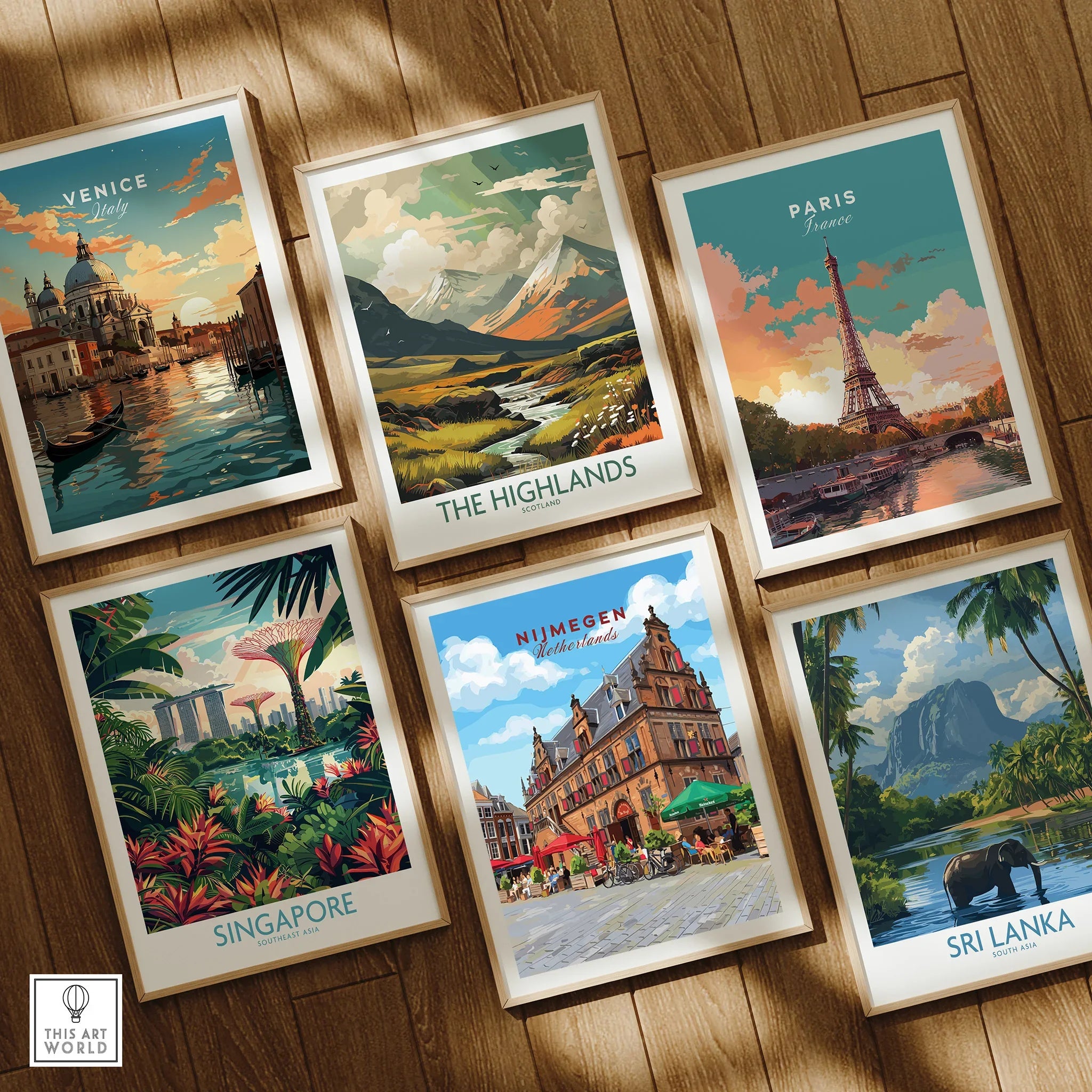 Set of six framed travel posters featuring Venice, Paris, Singapore, Nijmegen, Highlands, and Sri Lanka, displayed on a wooden floor.