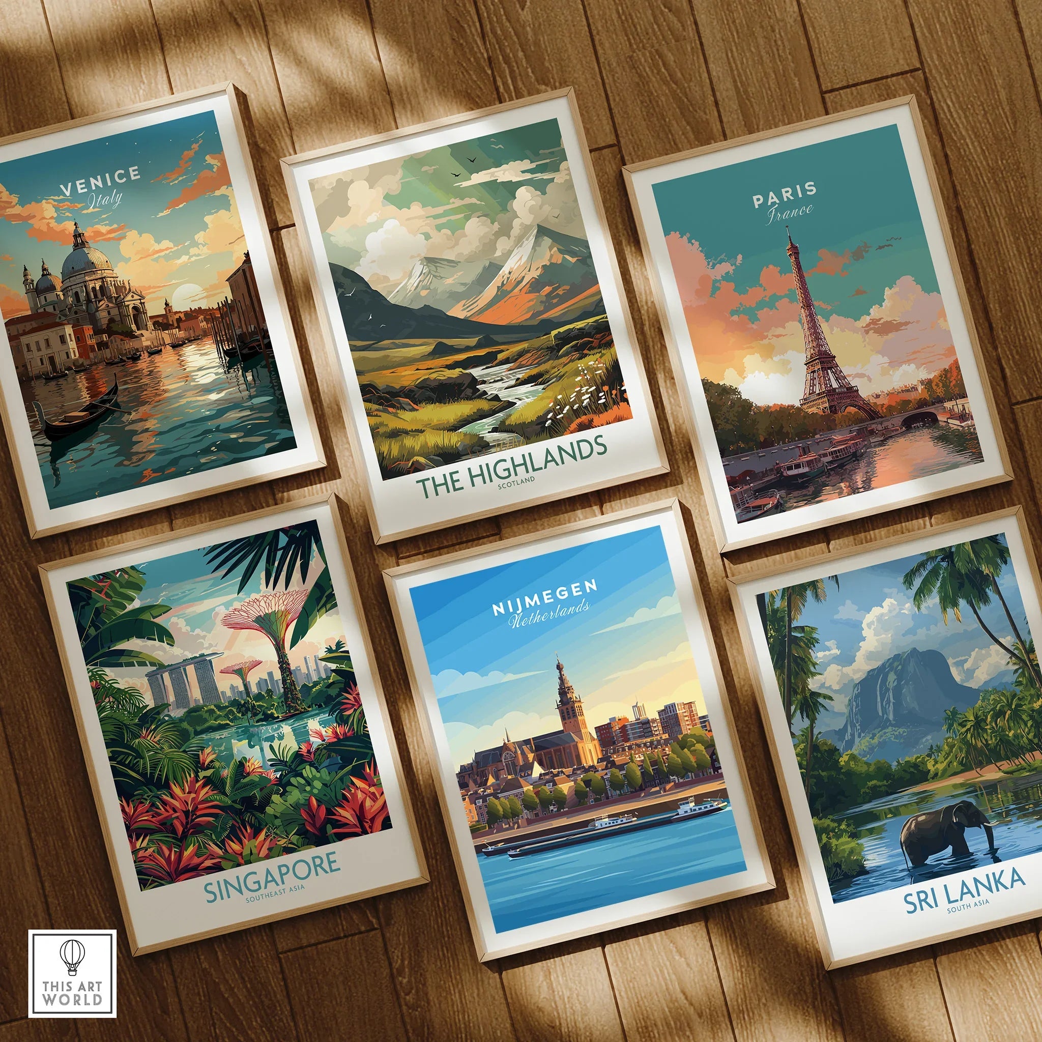 Set of six framed travel posters featuring Venice, Paris, Singapore, Sri Lanka, The Highlands, and Nijmegen on a wooden floor.