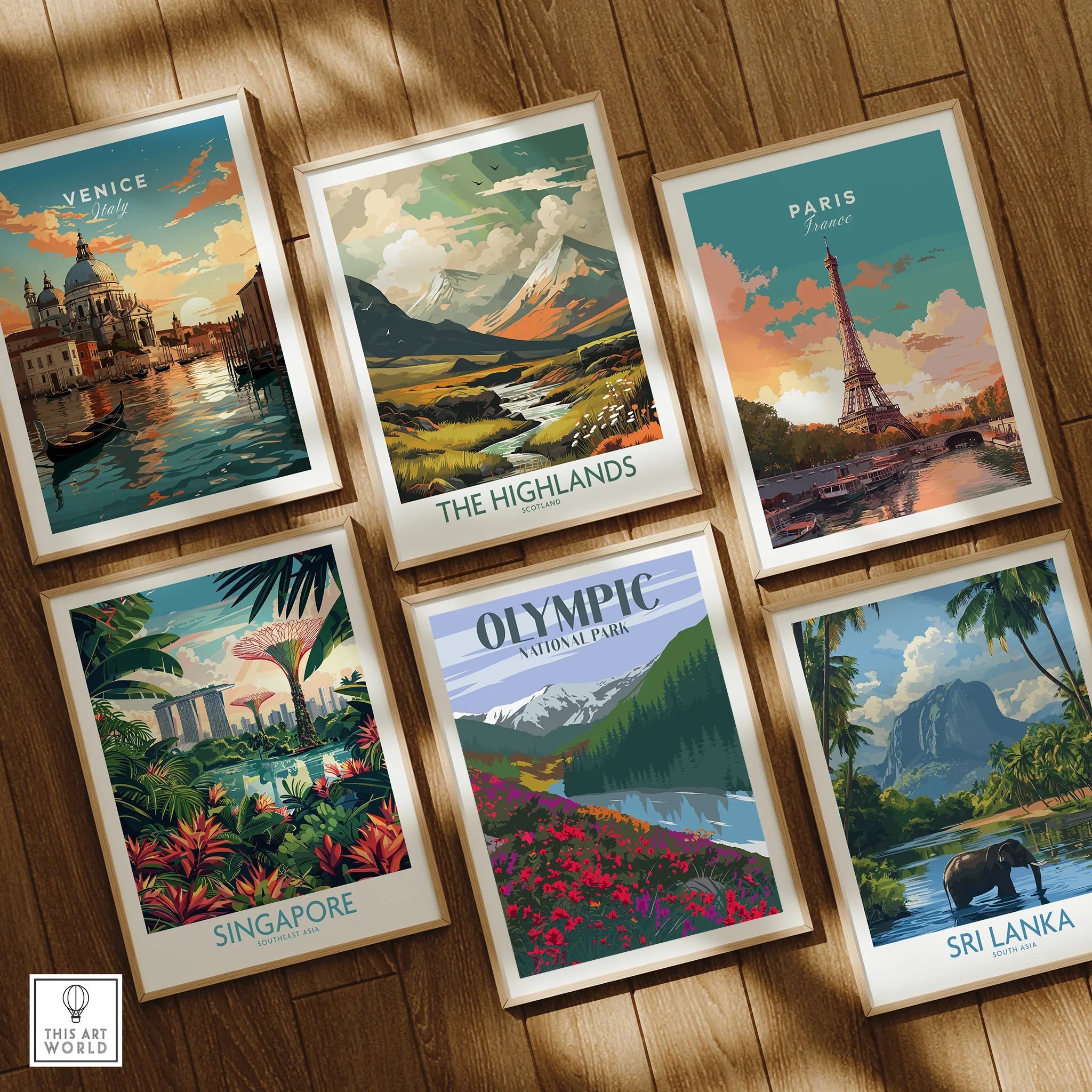 Set of six framed travel art prints featuring Venice, Paris, Singapore, and nature landscapes on a wooden floor.