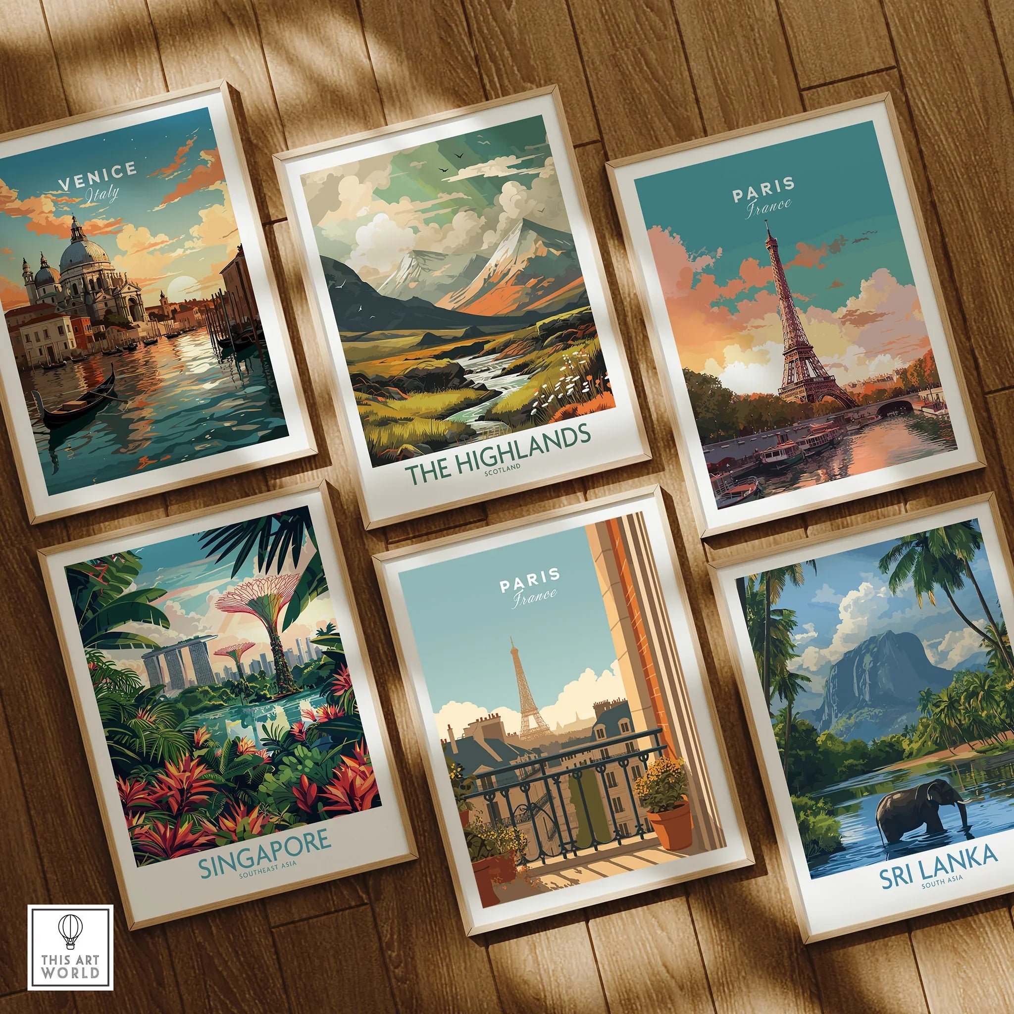 Set of six framed travel art prints with city and nature scenes on a wooden floor