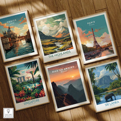 Set of six framed travel posters featuring Venice, Paris, The Highlands, Singapore, Pico do Arieiro, and Sri Lanka, arranged on a wooden floor.
