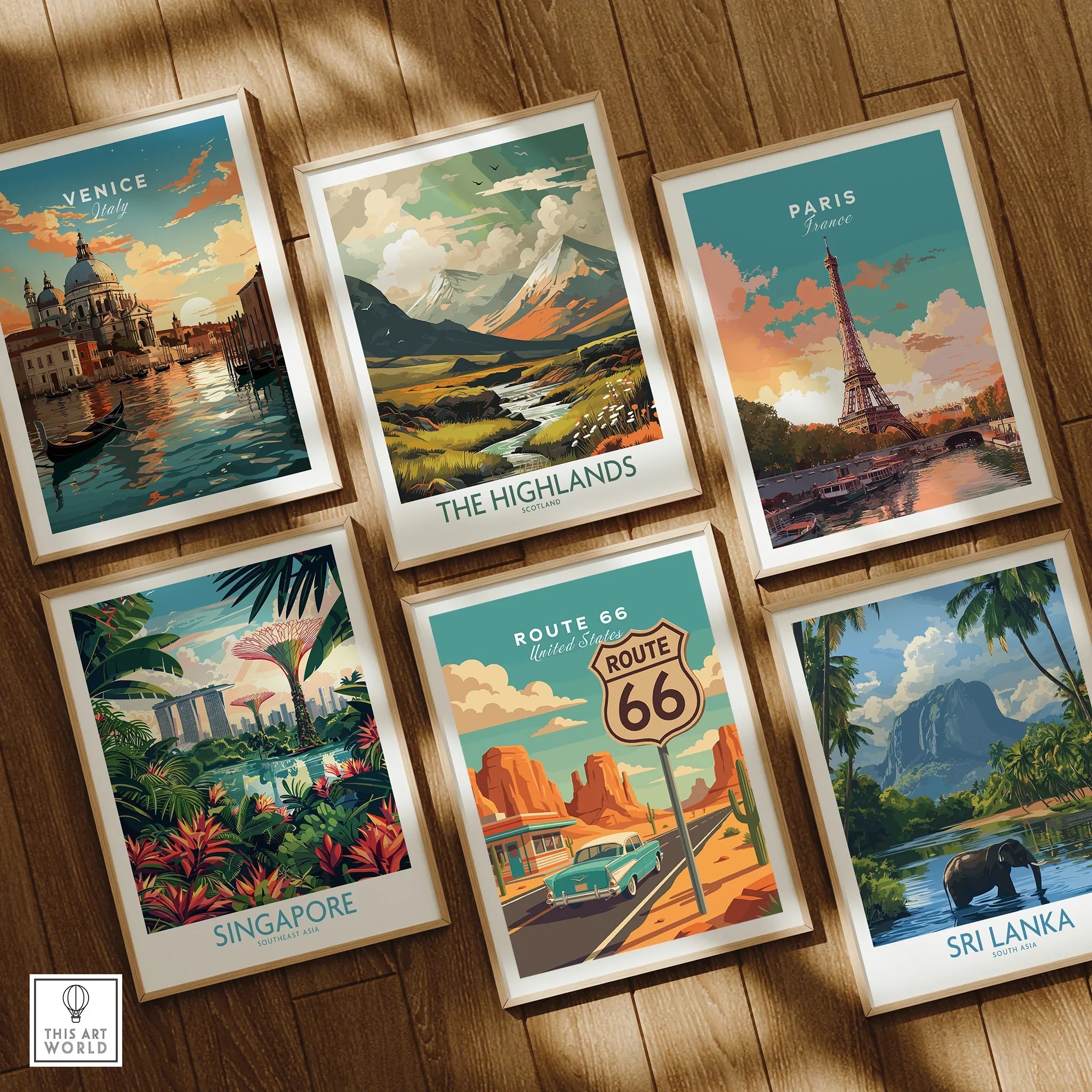 Set of six framed travel posters featuring Venice, Highlands, Paris, Singapore, Route 66, and Sri Lanka on a wooden floor.