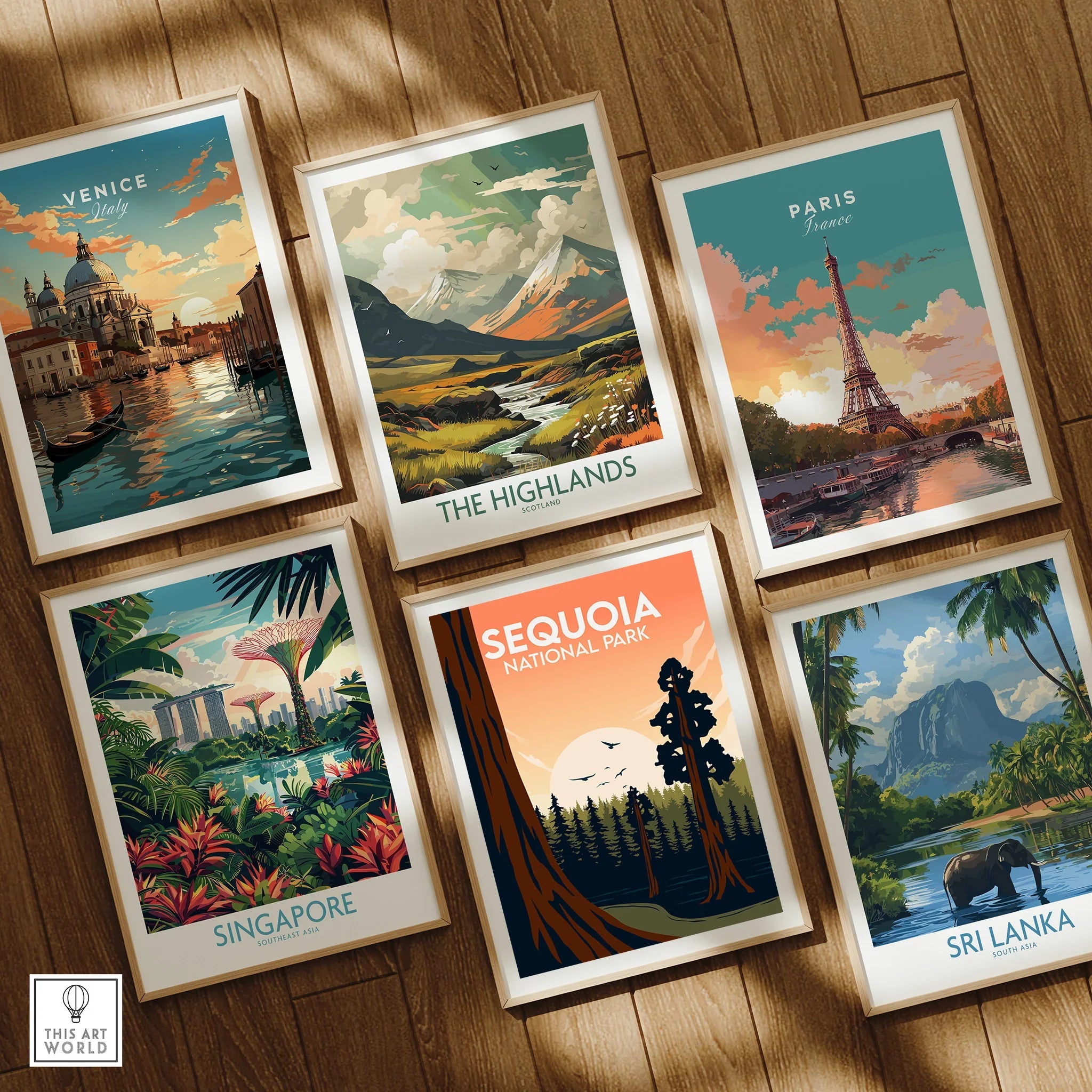 Set of six framed art prints featuring travel poster designs of Venice, Paris, Highlands, Singapore, Sequoia National Park, and Sri Lanka on a wooden floor.