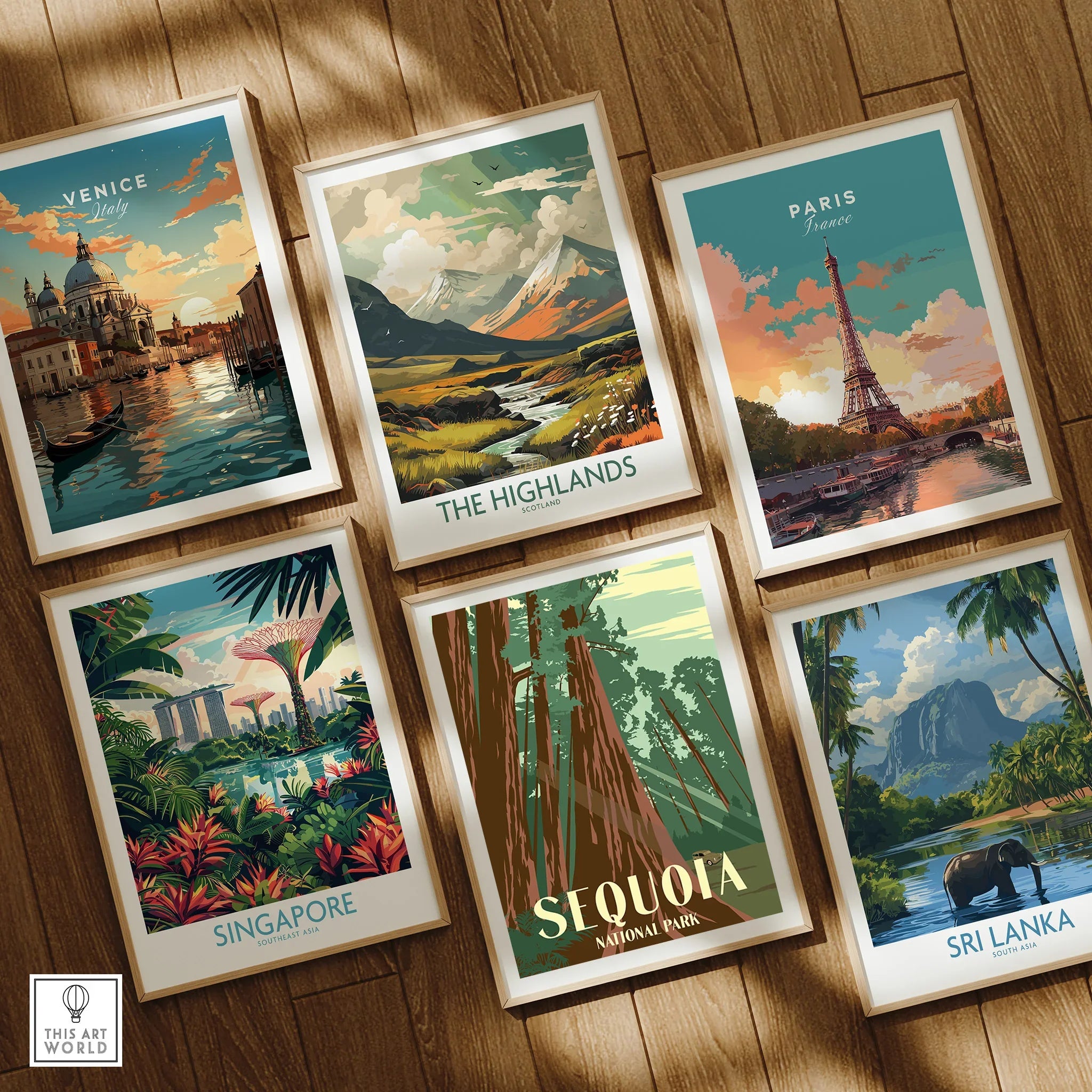 Set of six framed art prints featuring travel posters of Venice, Paris, Highlands, Singapore, Sequoia National Park, and Sri Lanka on a wooden floor.