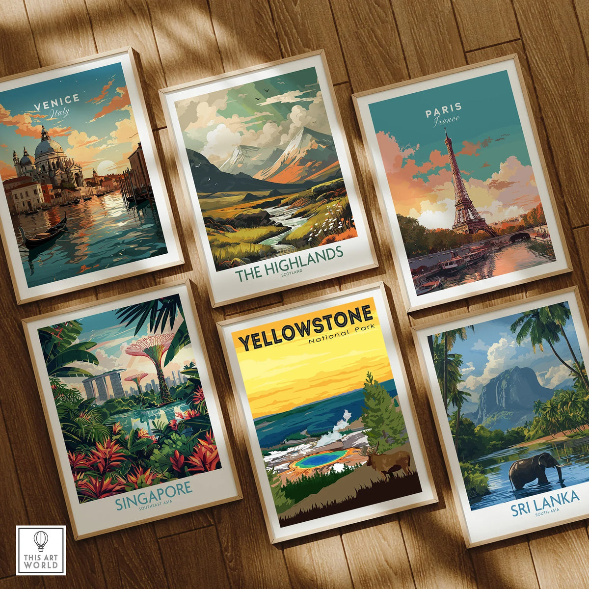 Set of six framed travel posters featuring Venice, The Highlands, Paris, Singapore, Yellowstone, and Sri Lanka on a wooden floor.