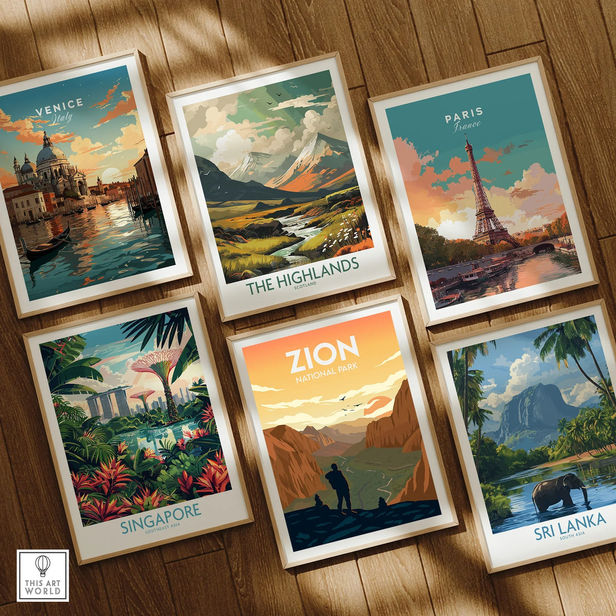 Set of six framed travel posters featuring Venice, Highlands, Paris, Singapore, Zion, Sri Lanka on wood floor