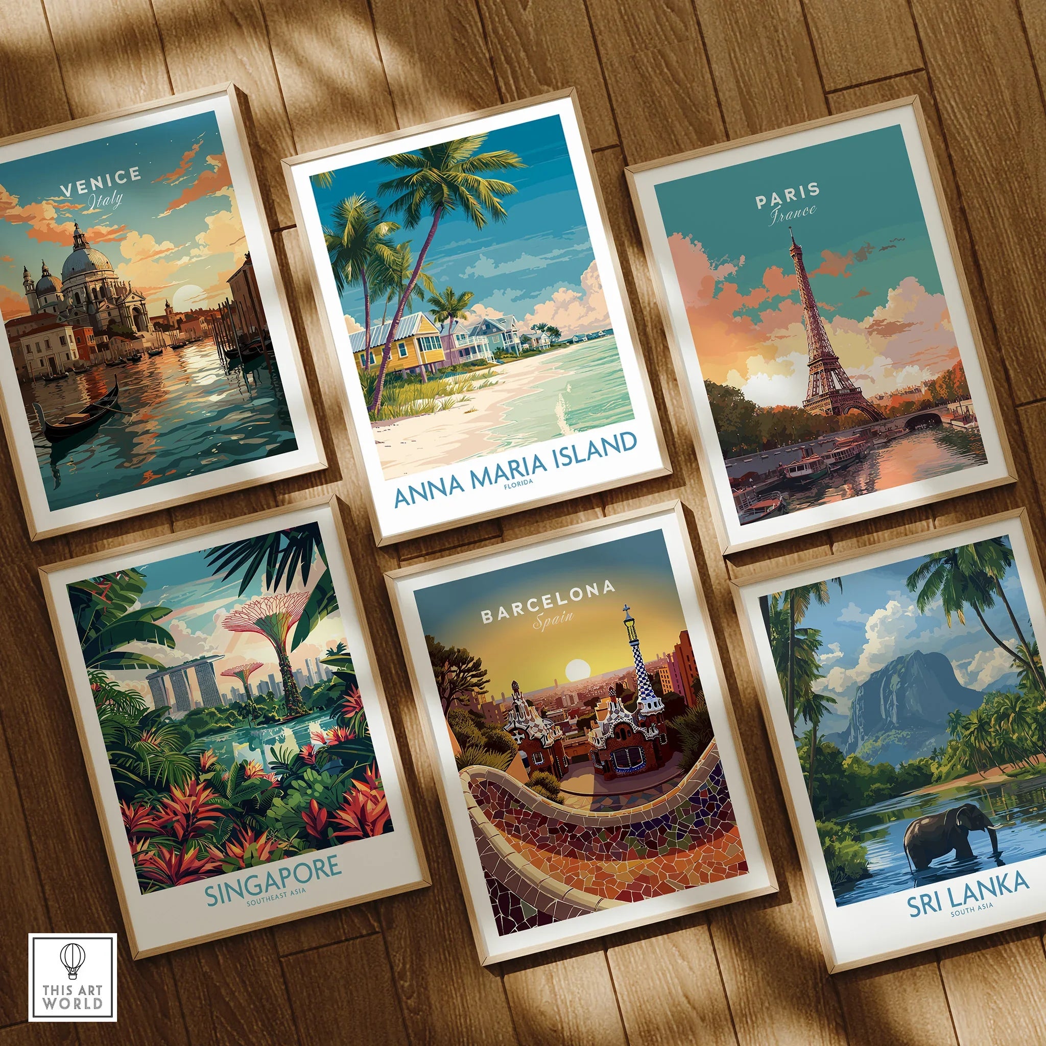 Set of six framed travel art prints featuring Venice, Paris, Anna Maria Island, Singapore, Barcelona, and Sri Lanka, displayed on a wooden floor.