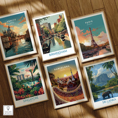 Set of six framed travel posters featuring Venice, Birmingham, Paris, Singapore, Barcelona, Sri Lanka on wooden floor.