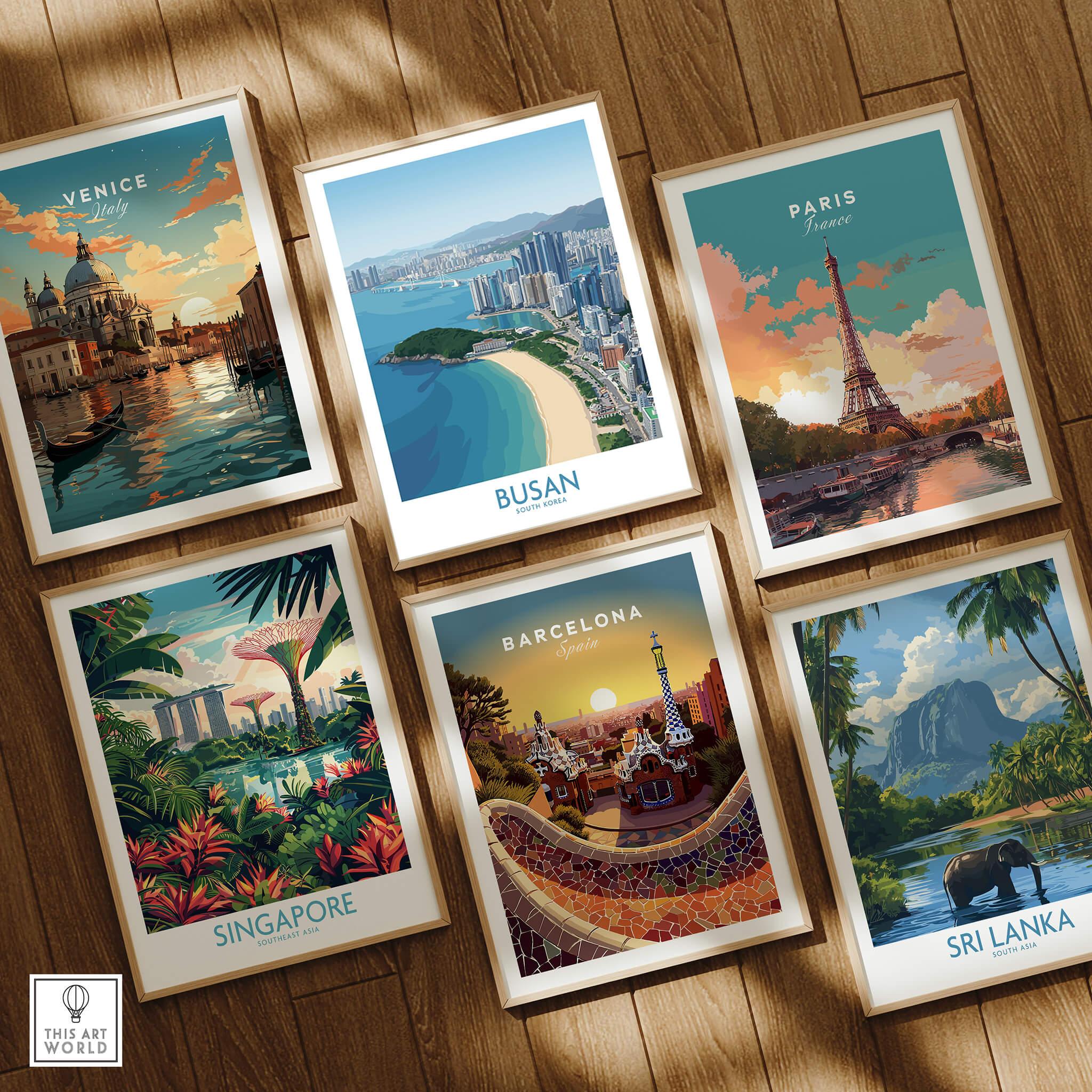 Set of six framed travel art prints featuring Venice, Busan, Paris, Singapore, Barcelona, and Sri Lanka displayed on a wooden floor.