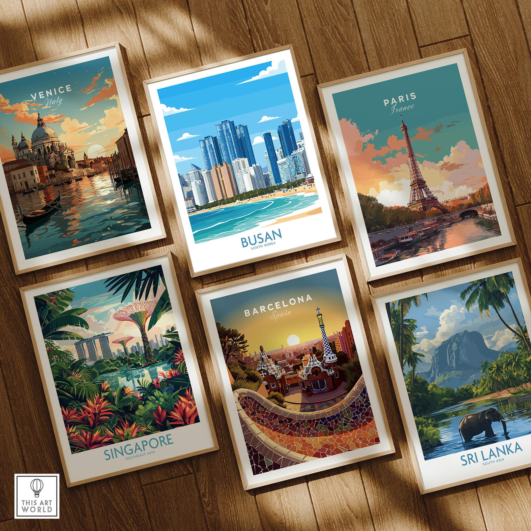 Set of six framed travel art prints featuring Venice, Busan, Paris, Singapore, Barcelona, and Sri Lanka on a wooden floor