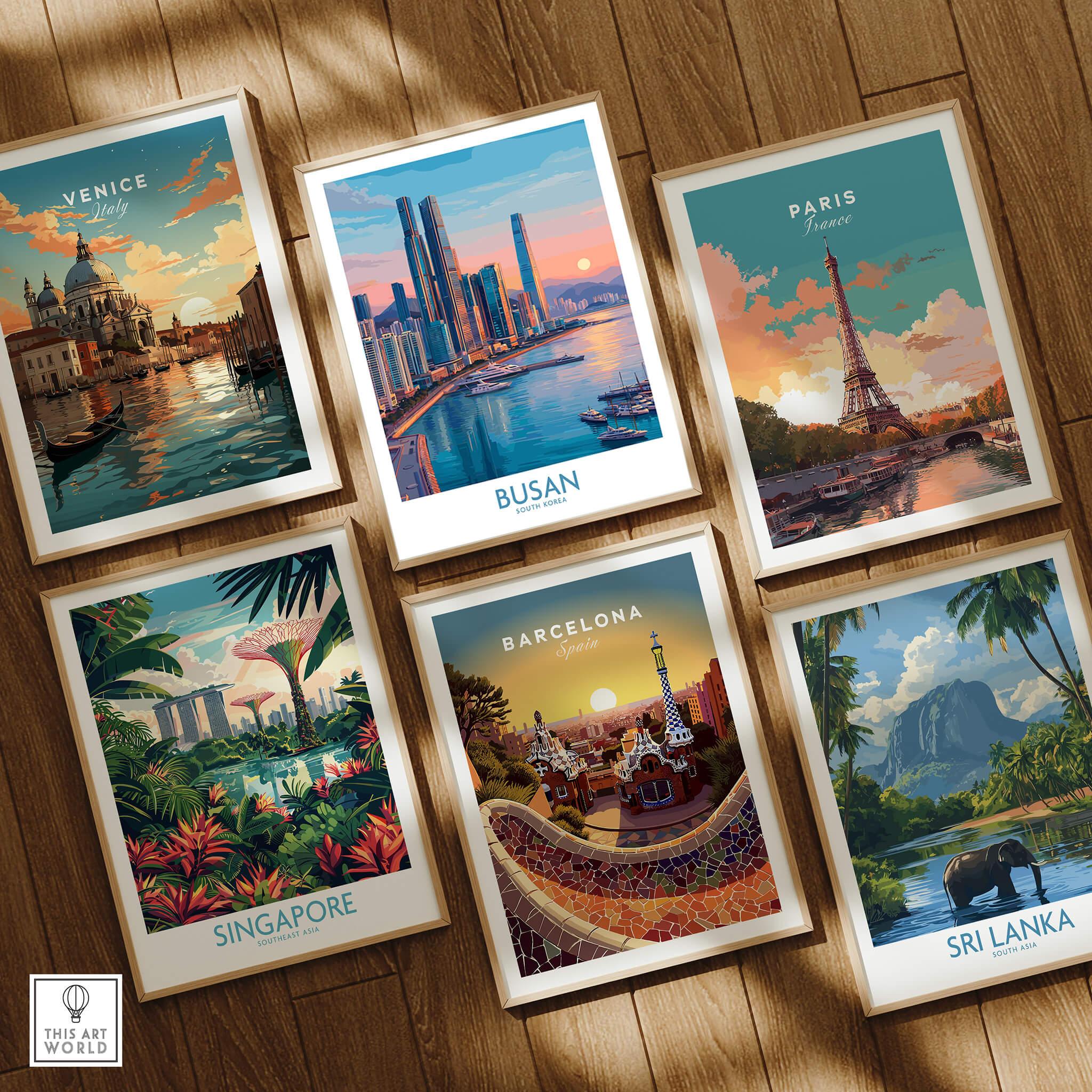 Set of six framed travel posters featuring Venice, Busan, Paris, Singapore, Barcelona, and Sri Lanka, displayed on a wooden floor.