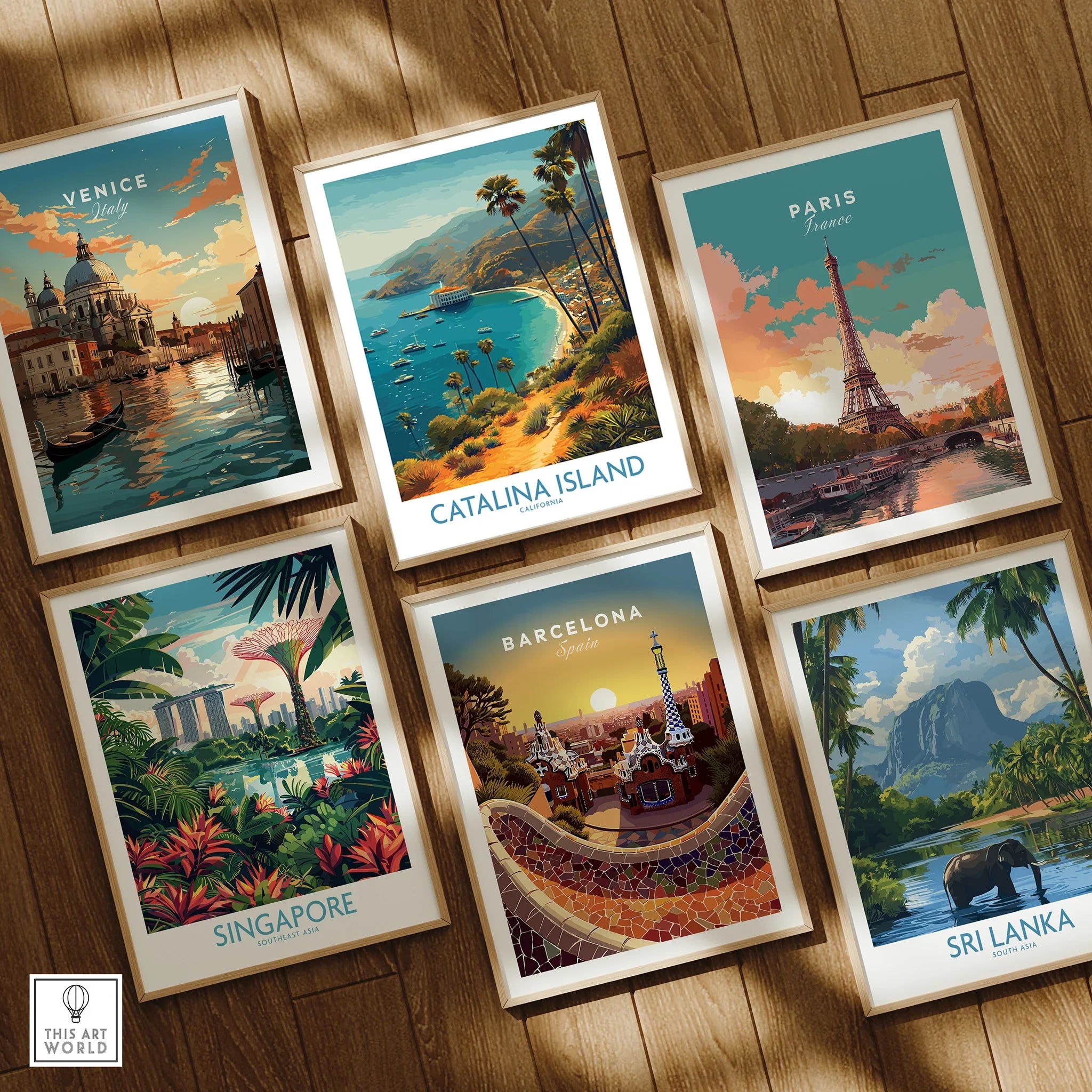 Set of six framed travel art prints featuring Venice, Catalina Island, Paris, Singapore, Barcelona, and Sri Lanka on a wooden floor.