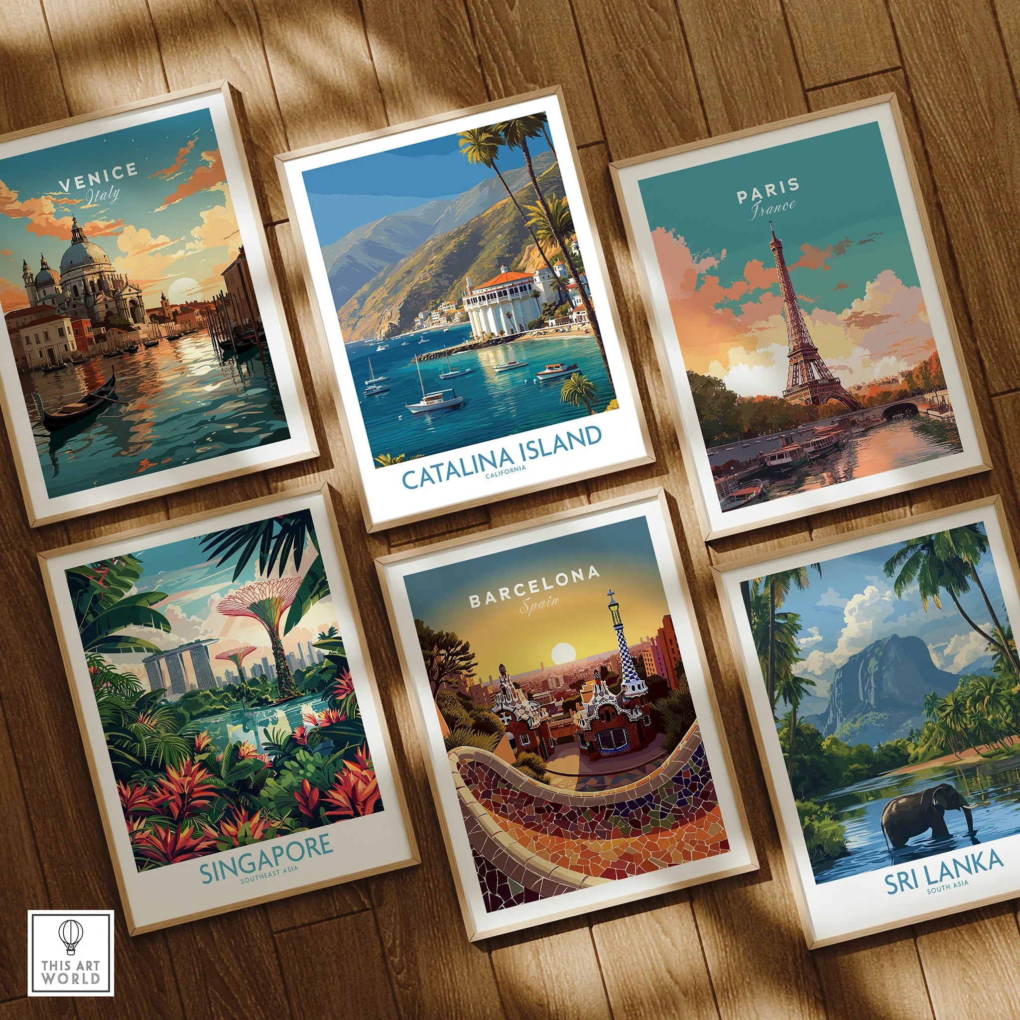 Set of six framed travel posters featuring Venice, Catalina Island, Paris, Singapore, Barcelona, and Sri Lanka on a wooden floor.