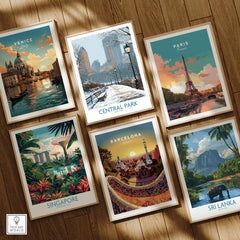 Set of six framed travel art prints on wooden floor featuring Venice, Central Park, Paris, Singapore, Barcelona, and Sri Lanka.