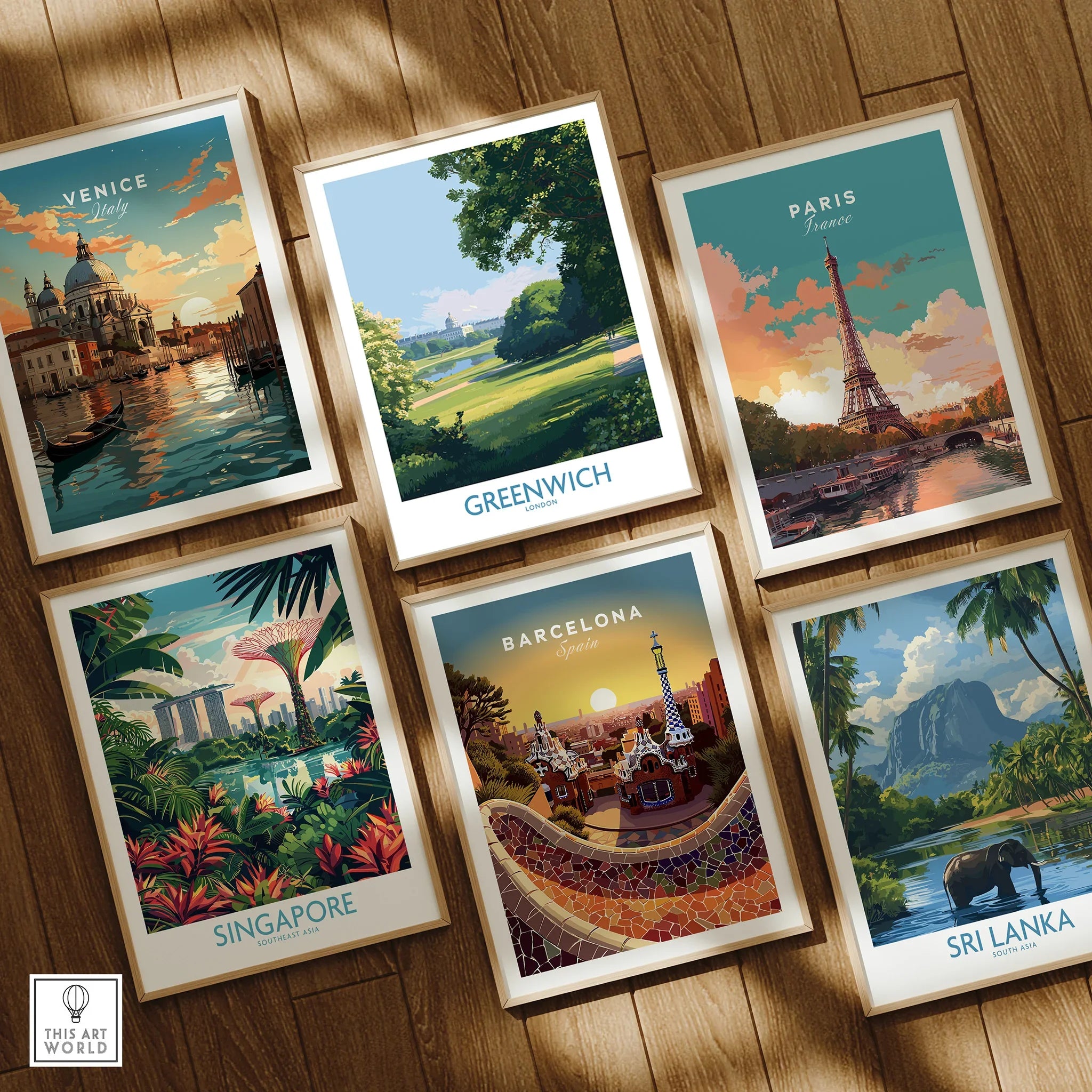 Set of six framed travel art prints of Venice, Greenwich, Paris, Singapore, Barcelona, Sri Lanka on wooden floor