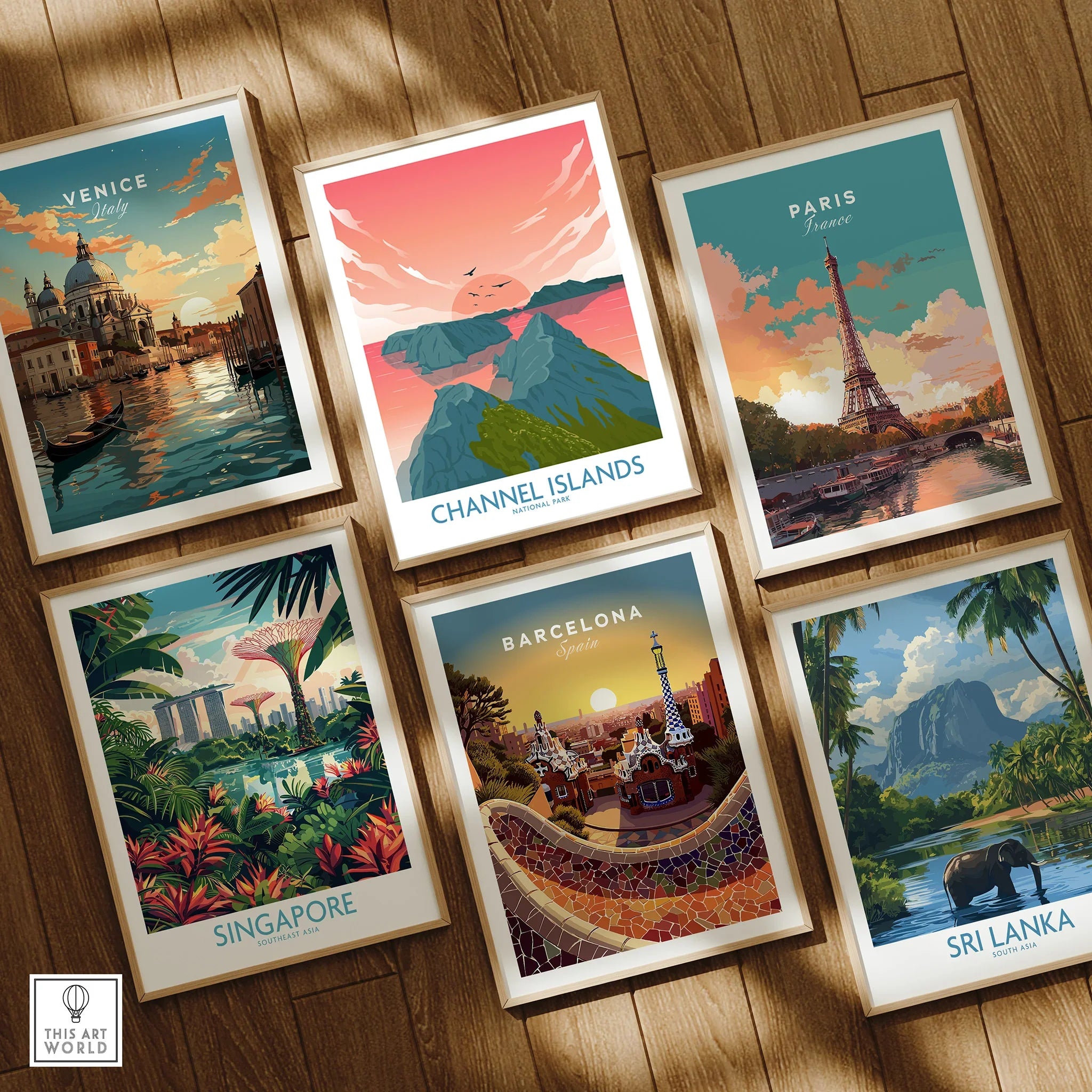 Set of six framed travel posters featuring Venice, Channel Islands, Paris, Singapore, Barcelona, and Sri Lanka, displayed on a wooden floor.