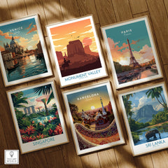 Set of six framed travel posters featuring Venice, Monument Valley, Paris, Singapore, Barcelona, and Sri Lanka on a wooden floor.