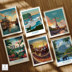 Six framed travel posters featuring Venice, Olympic National Park, Paris, Singapore, Barcelona, and Sri Lanka on a wooden floor.