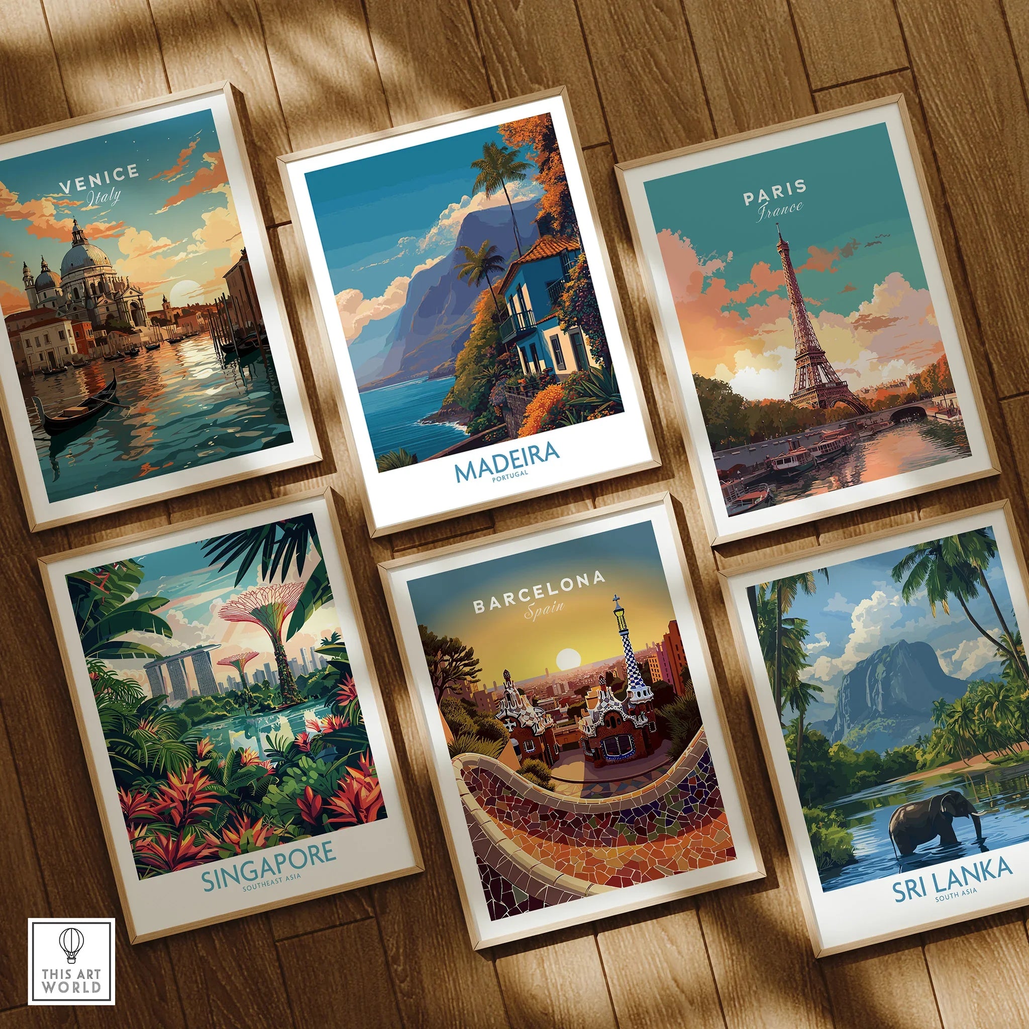 Set of six framed travel art prints with city and nature scenes on a wooden floor