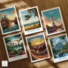 Set of six travel art prints in natural wood frames on wooden floor, featuring Venice, Richmond Park, Paris, Singapore, Barcelona, and Sri Lanka scenes.