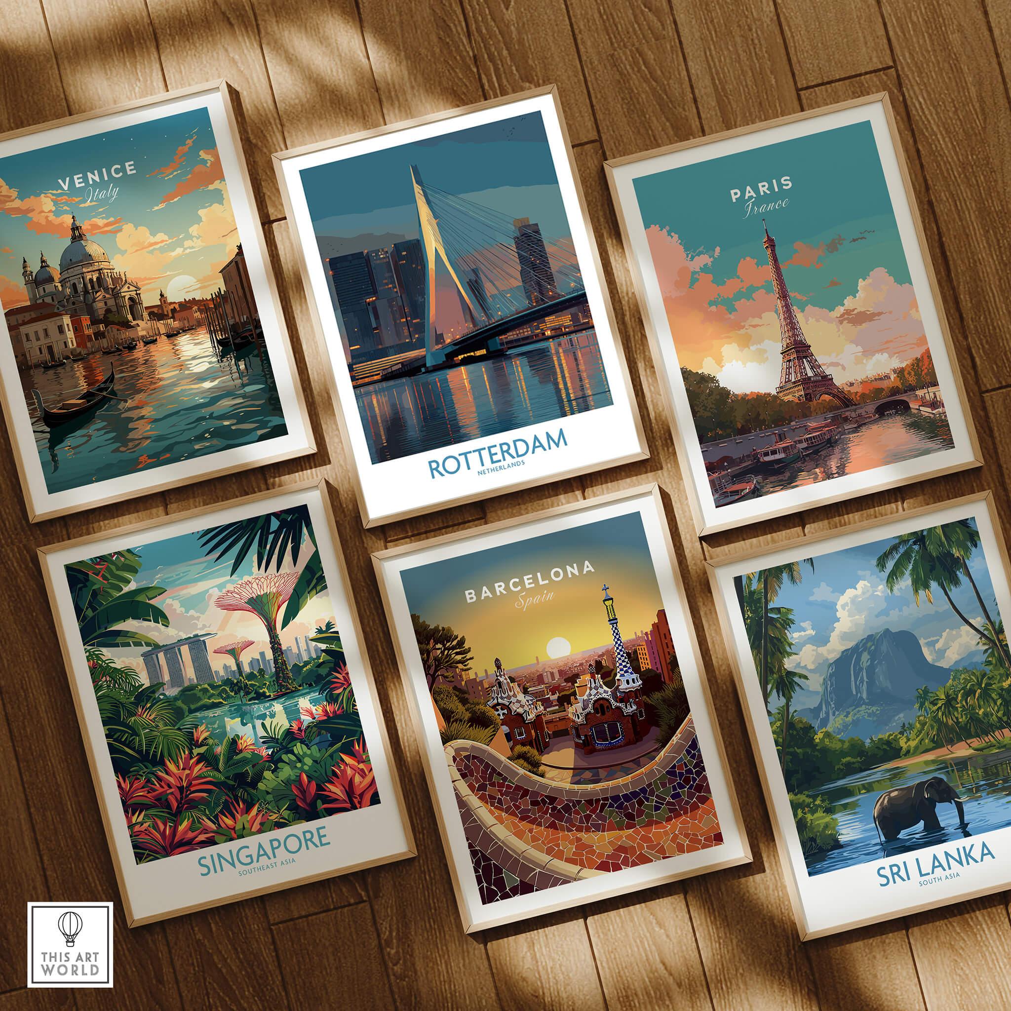 Set of six framed travel art prints on wooden floor featuring Venice, Rotterdam, Paris, Singapore, Barcelona, and Sri Lanka landmarks.