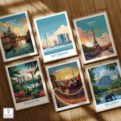 Set of six framed travel posters featuring Venice, Rotterdam, Paris, Singapore, Barcelona, and Sri Lanka, arranged on a wooden floor.