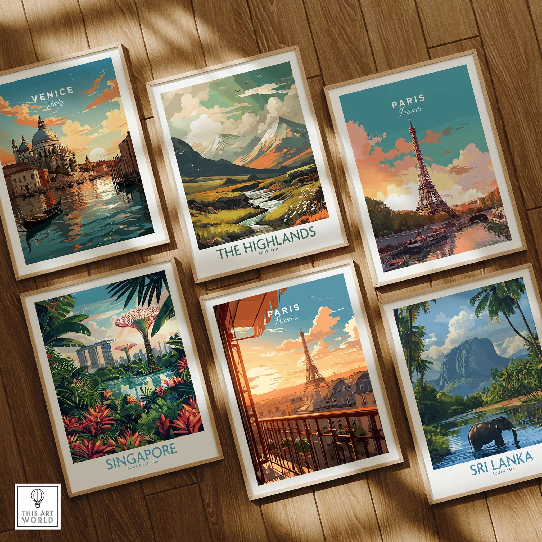 Paris Eiffel Tower Poster and other framed travel prints on a wooden floor.