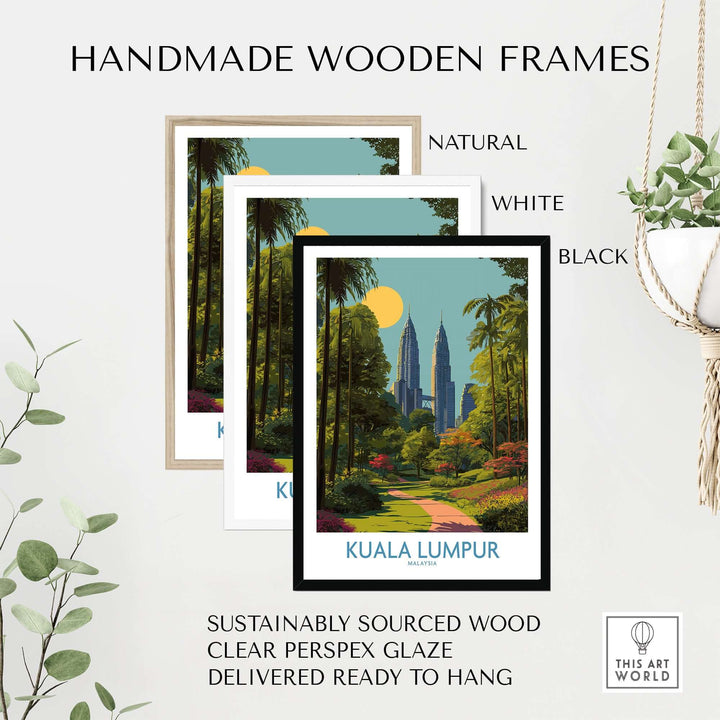 Handmade wooden frames in natural, white, and black highlighting a Kuala Lumpur travel poster surrounded by greenery.