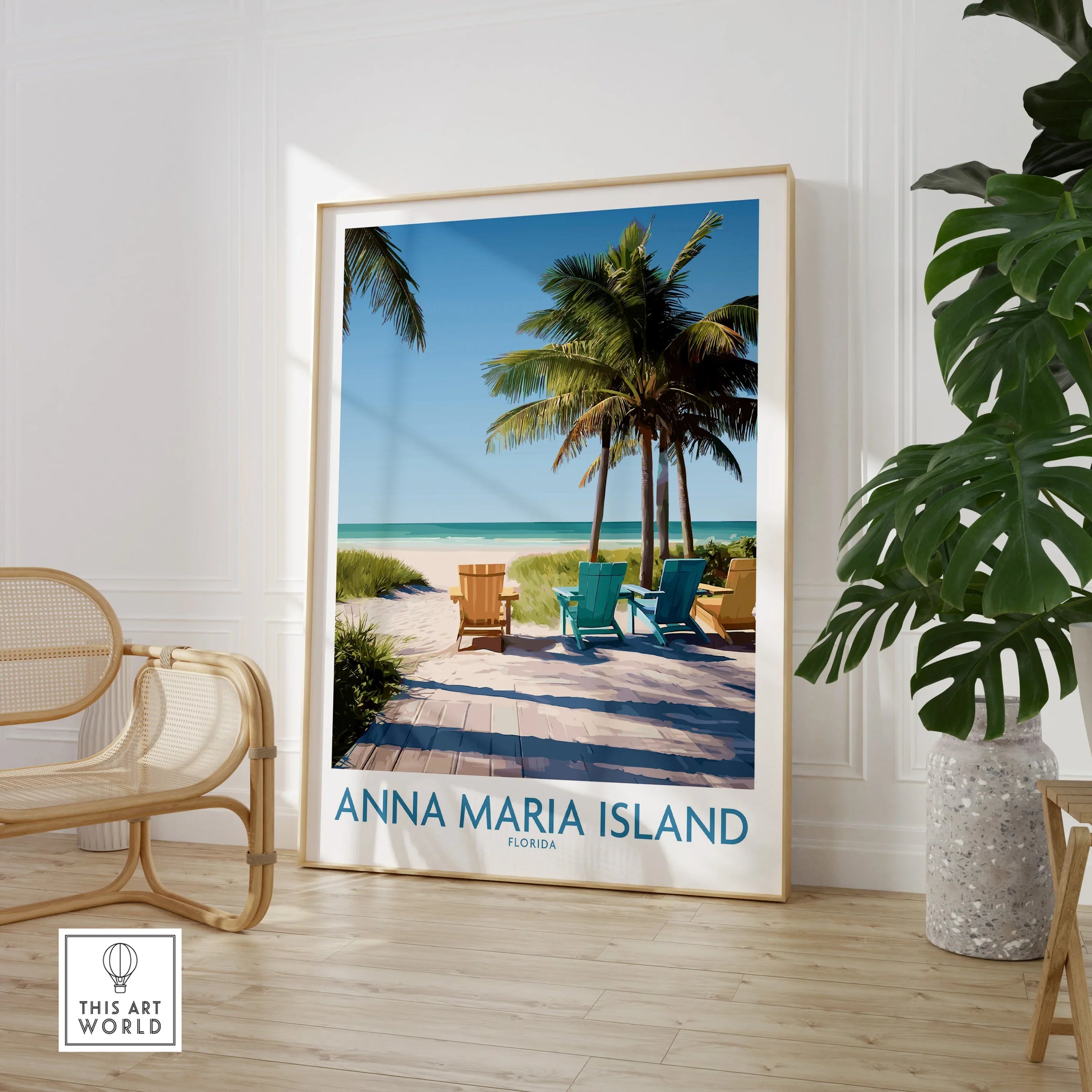 Framed Anna Maria Island beach travel print with palm trees in modern room, rattan chair, potted plant