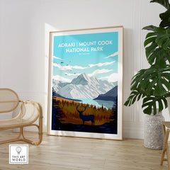 Framed Aoraki Mount Cook National Park print with deer in modern room, plant and chair decor