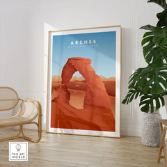 Framed Arches National Park travel poster in modern room with chair and plant