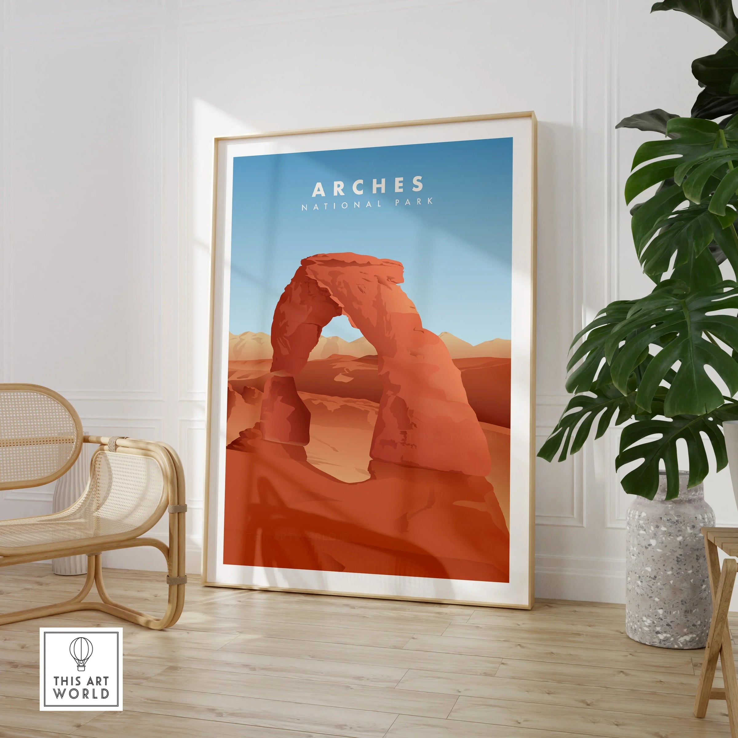 Framed Arches National Park travel poster in modern room with chair and plant