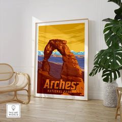 Arches National Park travel poster framed, displayed in modern room with chair and plant