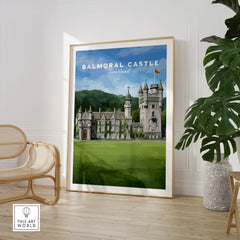 Framed Balmoral Castle Scotland travel poster in a modern room with chair and potted plant