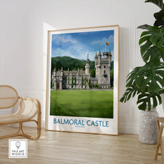 Framed Balmoral Castle Scotland travel poster in modern room with chair and plant