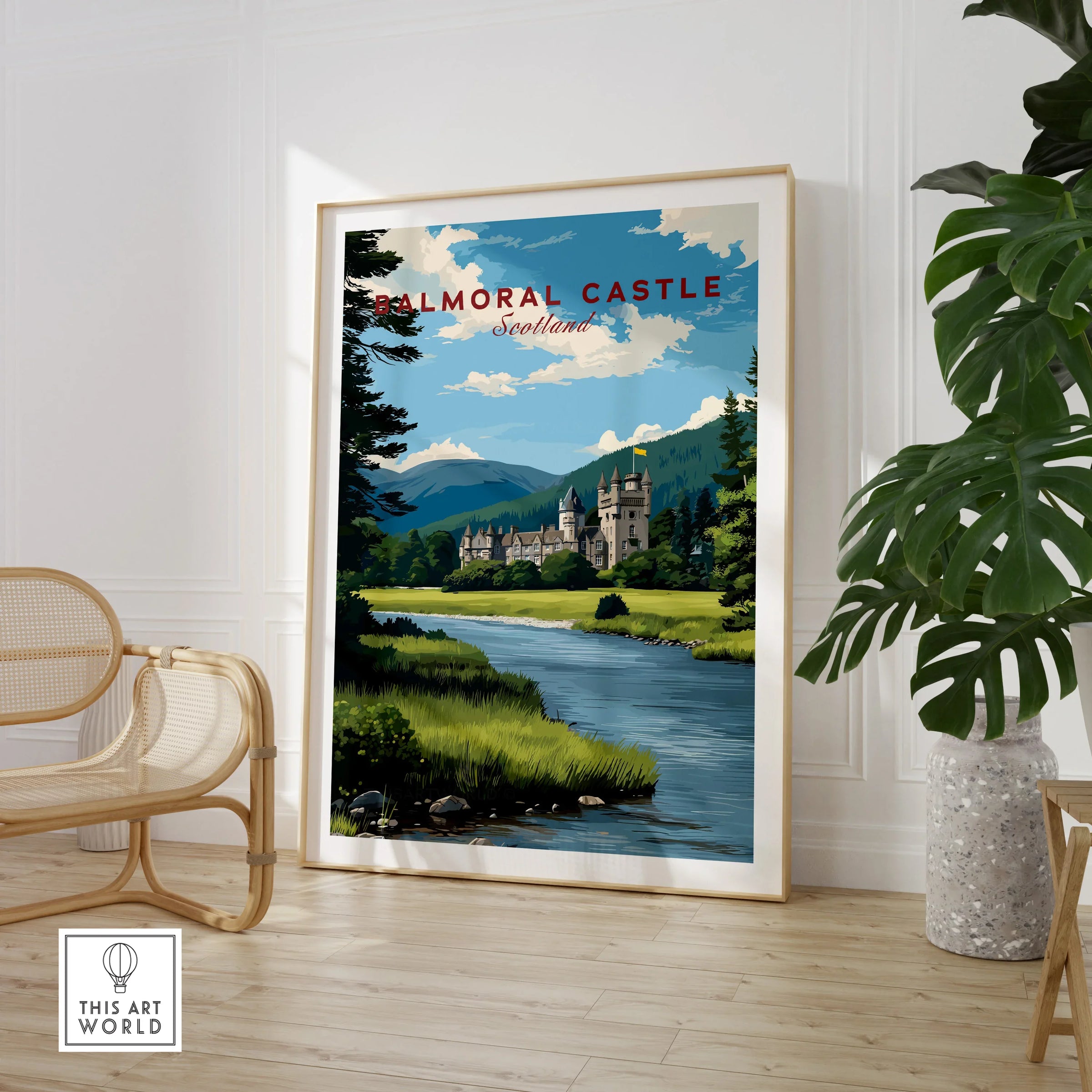Framed Balmoral Castle travel poster print in modern room with chair and plant