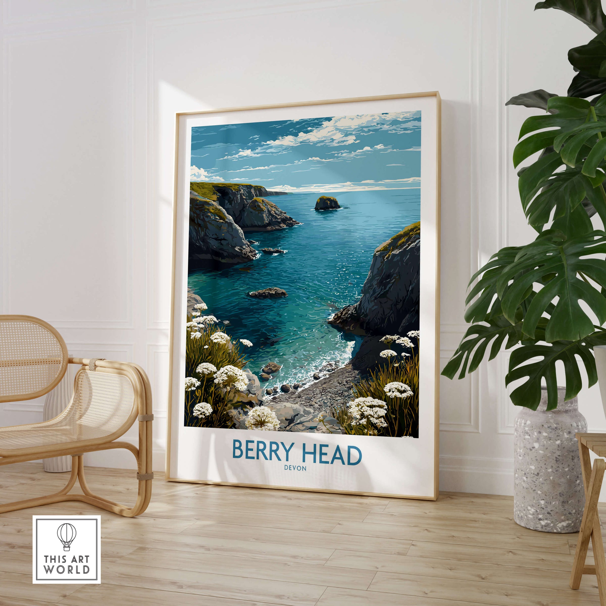 Berry Head Devon Print – Rocky Cliffs and Turquoise Sea Wall Decor displayed in a bright interior with a cozy chair.