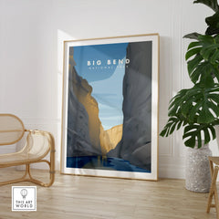 Framed Big Bend National Park travel poster art in modern living room with chair and plant