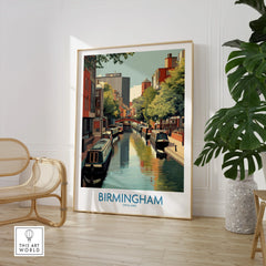 Framed Birmingham England travel poster art in modern room with chair and large plant