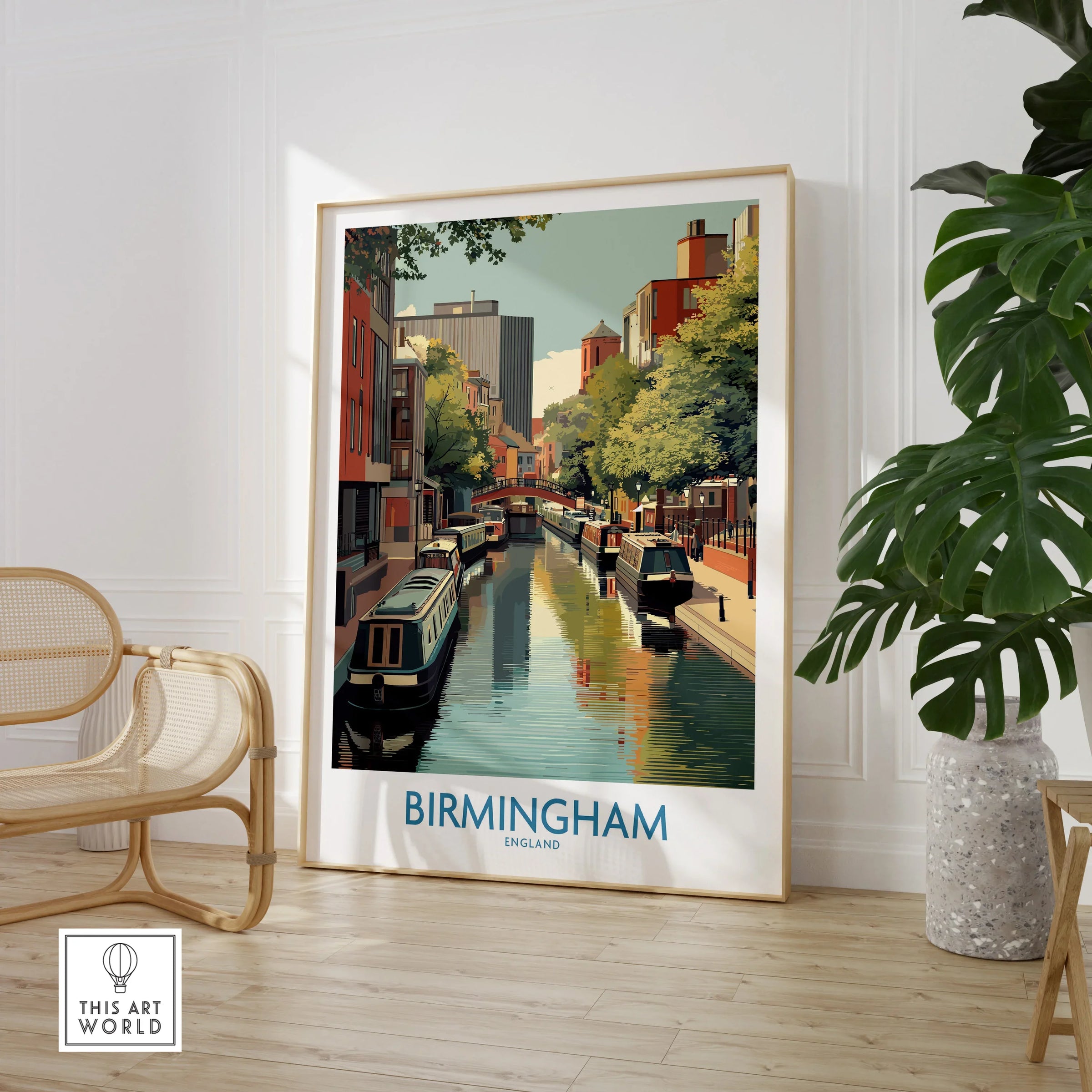 Framed Birmingham England travel poster art in modern room with chair and large plant