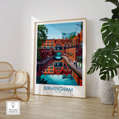 Framed Birmingham England cityscape wall art print in modern room with chair and plant