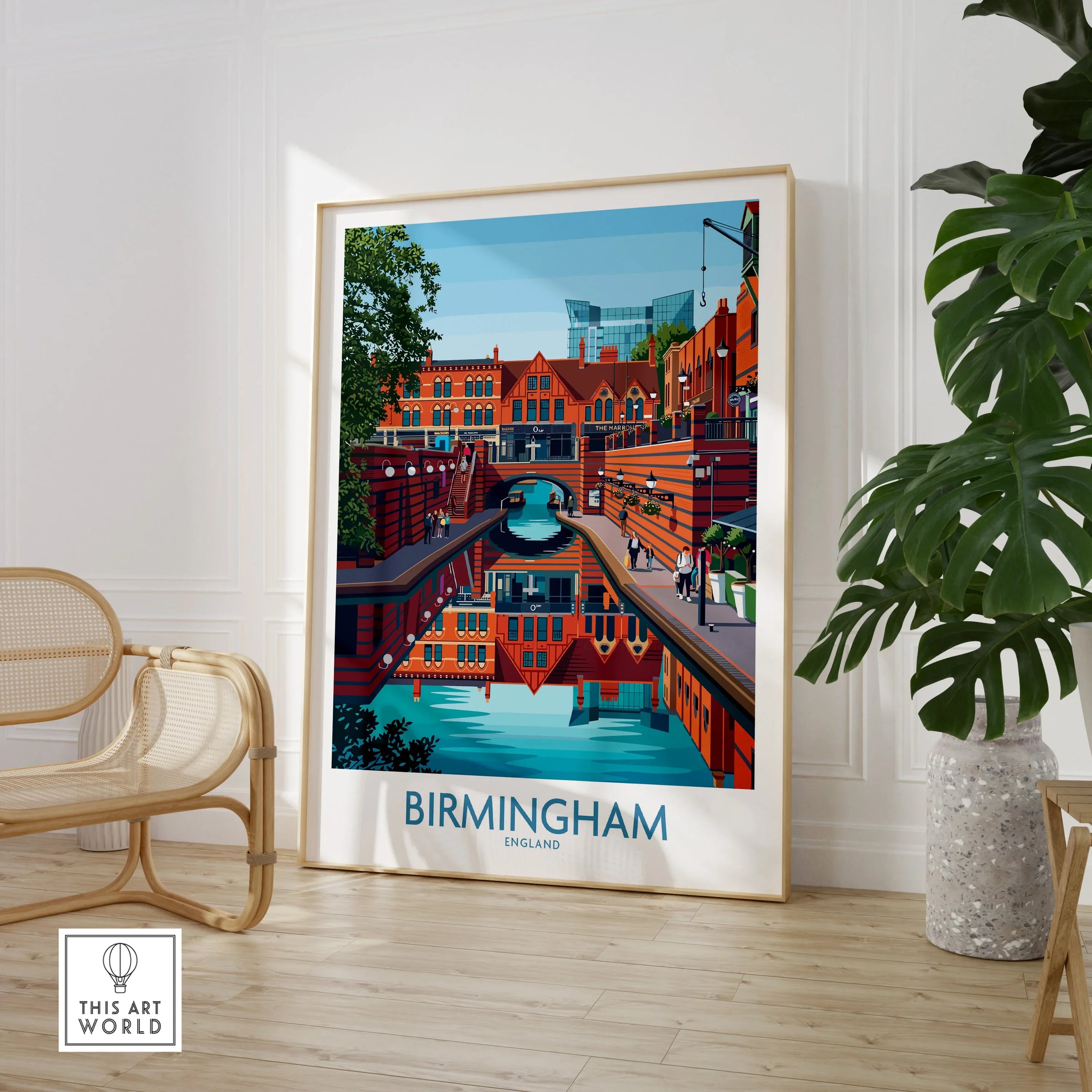 Framed Birmingham England cityscape wall art print in modern room with chair and plant