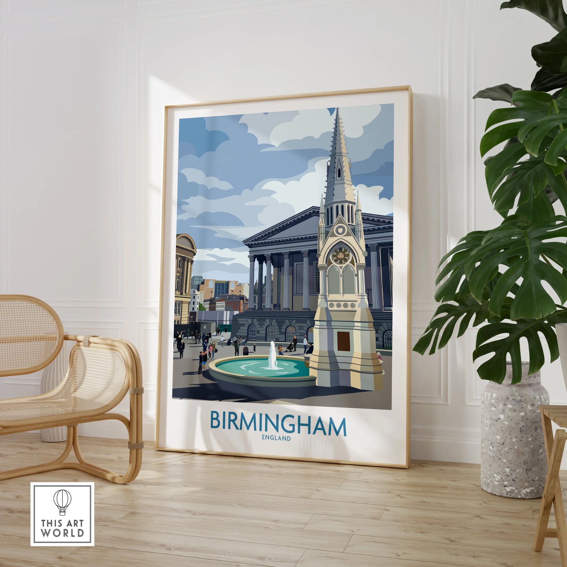 Framed Birmingham England cityscape travel poster in modern living room with chair and plant