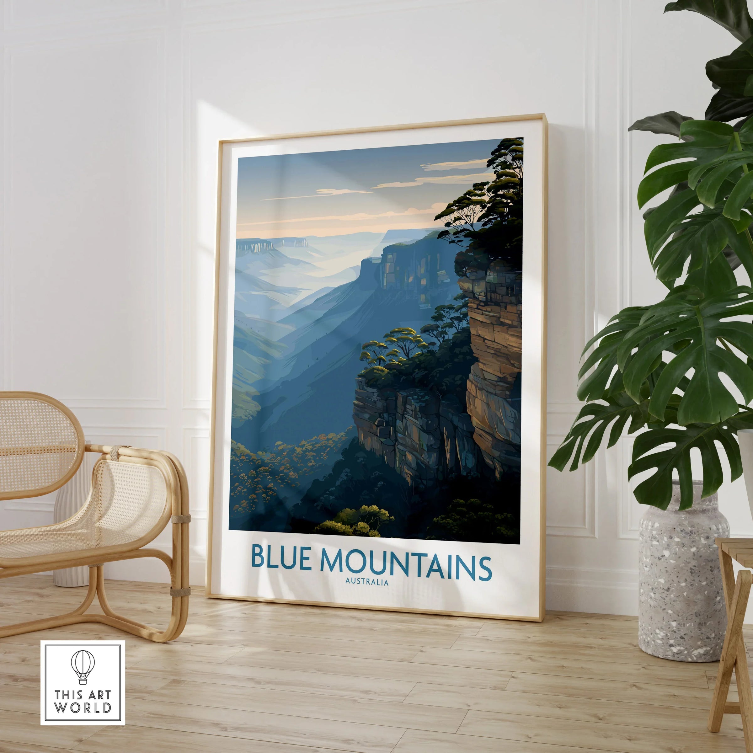 Framed Blue Mountains Australia travel poster in a modern room with chair and plant