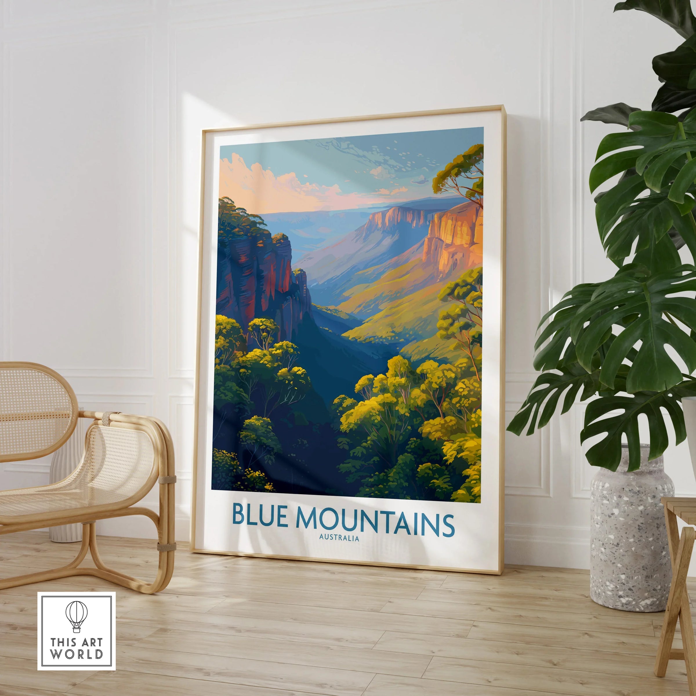 Framed Blue Mountains Australia travel poster in modern room with chair and green plant