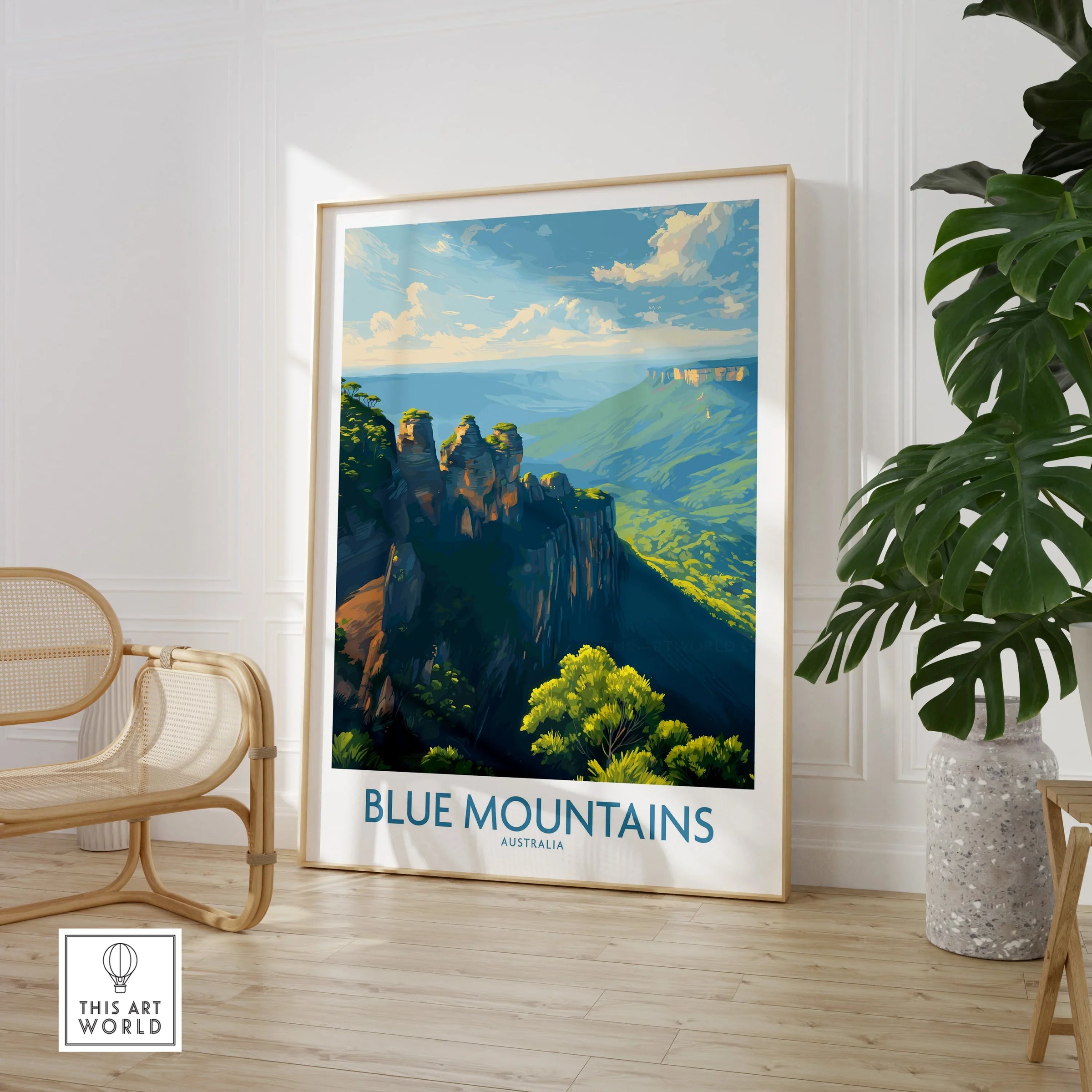 Framed Blue Mountains Australia travel poster in modern room with chair and large plant